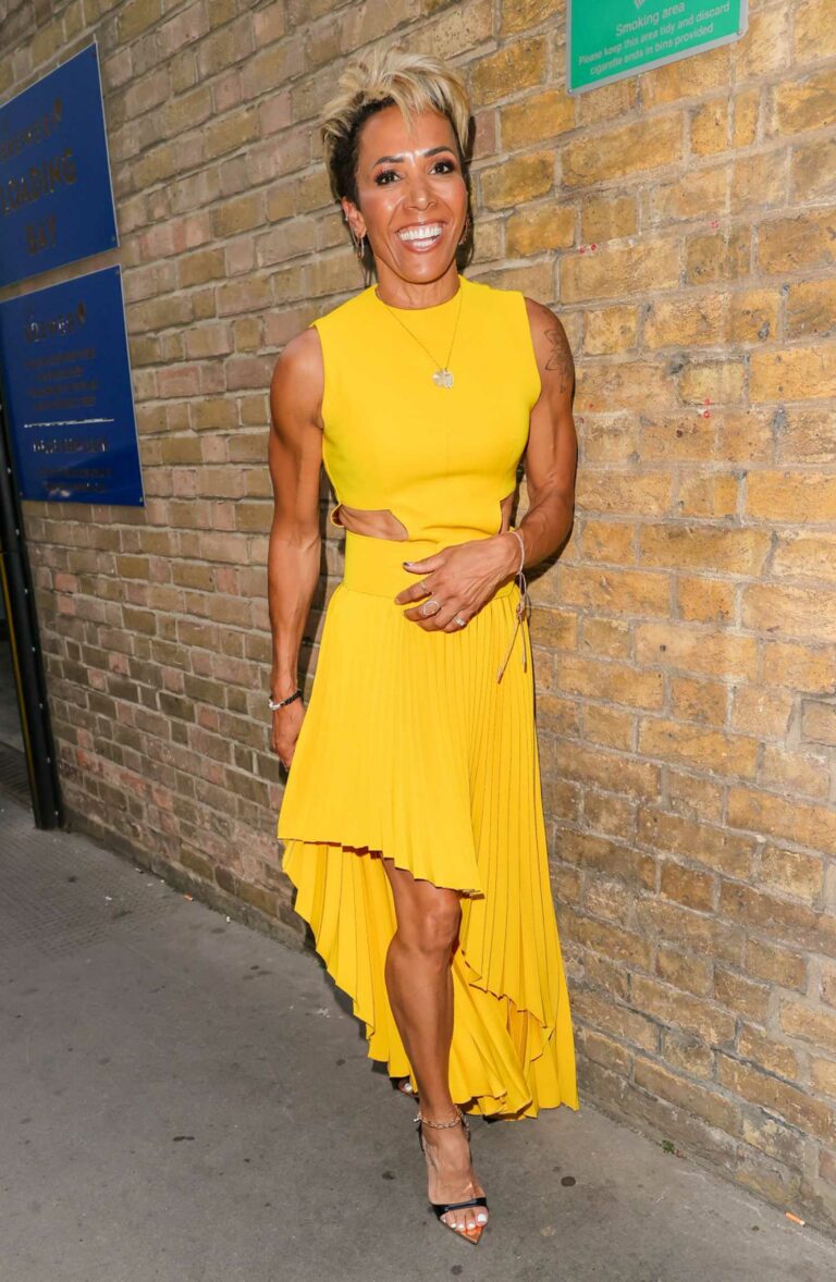 Kelly Holmes in a Yellow Dress Arrives at the British LGBT Awards in