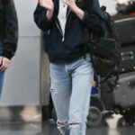 Kristen Stewart in a Blue Ripped Jeans Arrives at JFK Airport Out with Dylan Meyer in New York