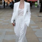 Matilda De Angelis in a White Pantsuit Arrives at Tiffany: Vision and Virtuosity Exhibition at Saatchi Gallery in London