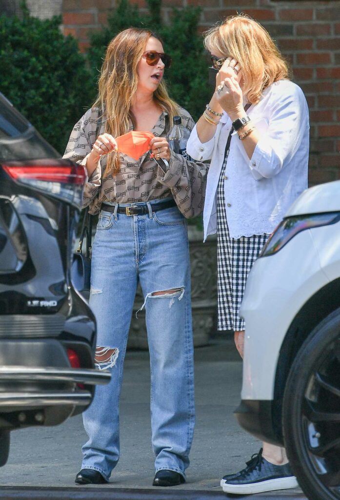 Ashley Tisdale in a Blue Ripped Jeans