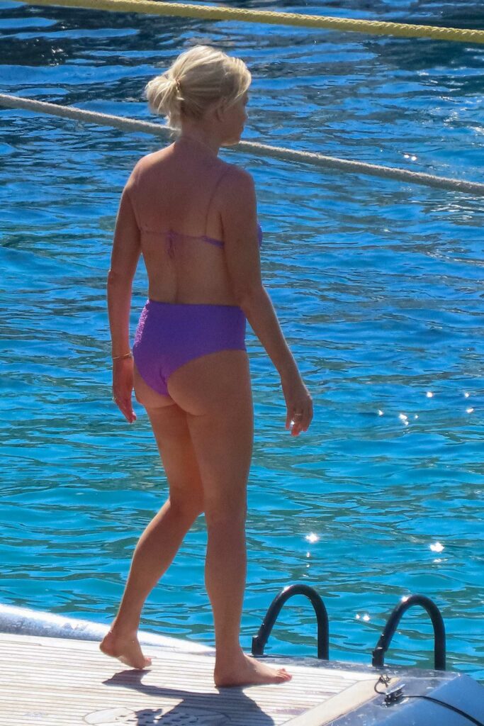 Caroline Stanbury in a Purple Bikini
