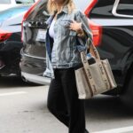 Kristin Cavallari in a White Cap Arrives at LAX Airport in Los Angeles
