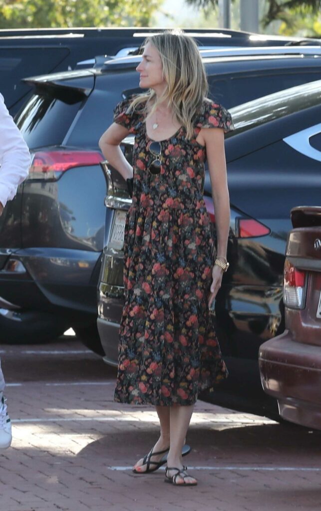 Molly McNearney in a Floral Dress