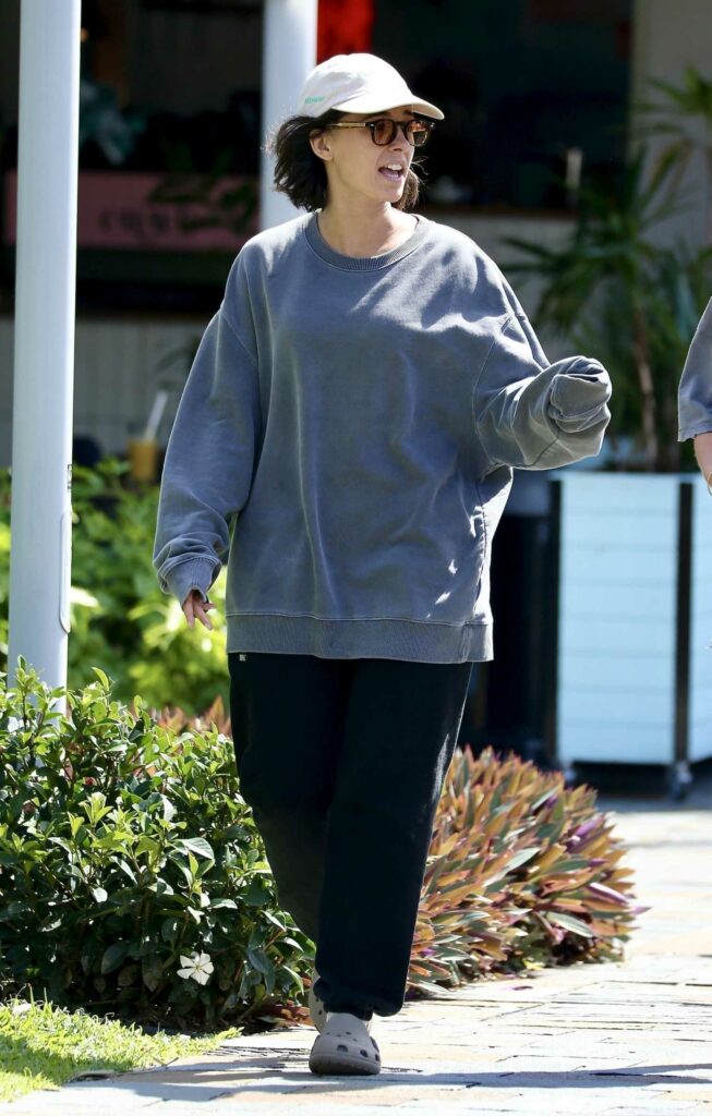 Naomi Scott in a Grey Sweatshirt