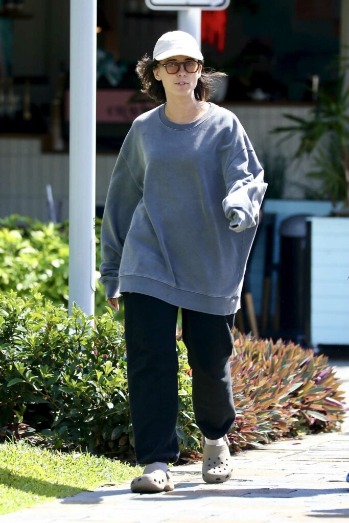 Naomi Scott in a Grey Sweatshirt