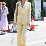Poppy Delevingne in a Yellow Pantsuit Attends The Wimbledon Men’s Singles Final at the All England Lawn Tennis and Croquet Club in London