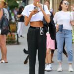 Alina Baikova in a White Cropped Tee Was Spotted Smoking Her Vape whilst Walking Around in New York City
