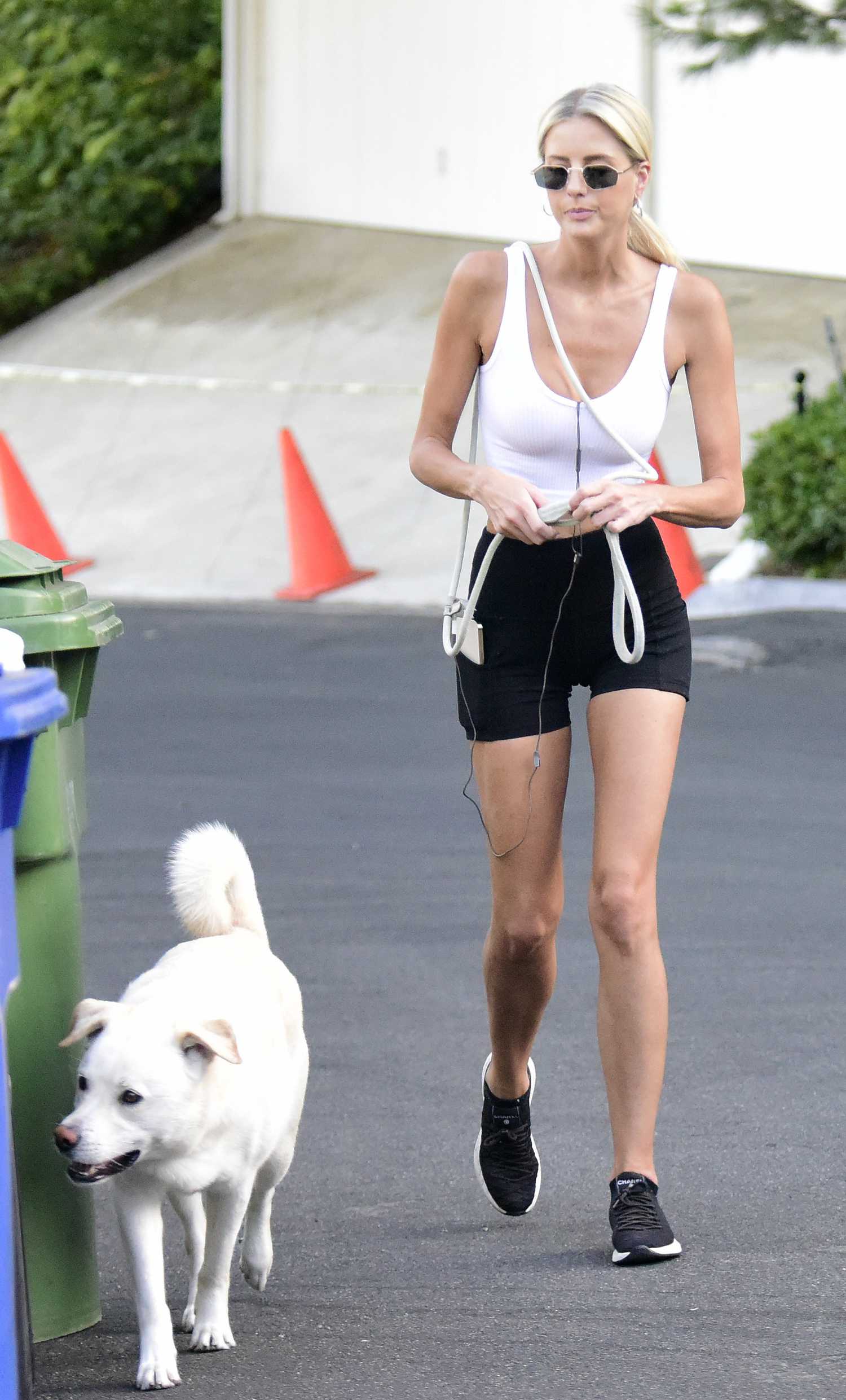 Emma Hernan in a White Top Walks Her Labrador Retriever in Los Angeles ...