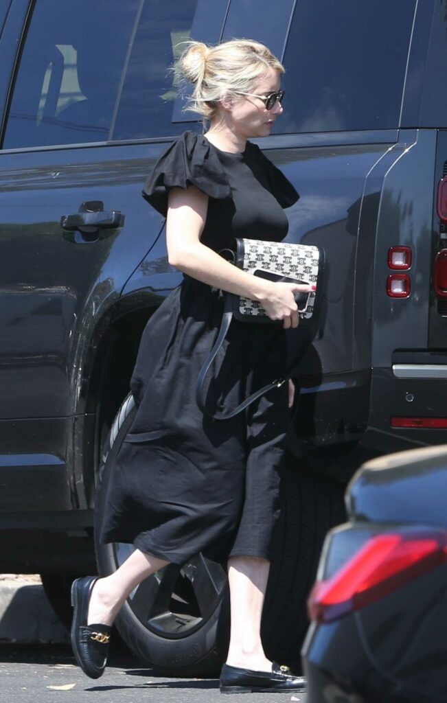 Emma Roberts in a Black Dress