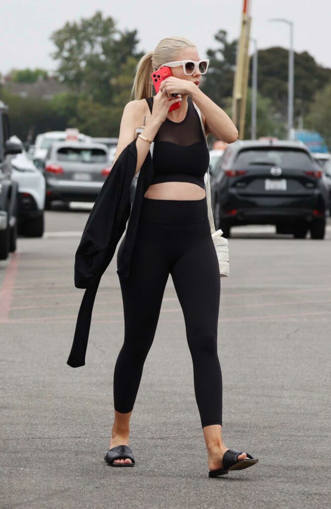 Heather Rae Young in a Black Workout Ensemble