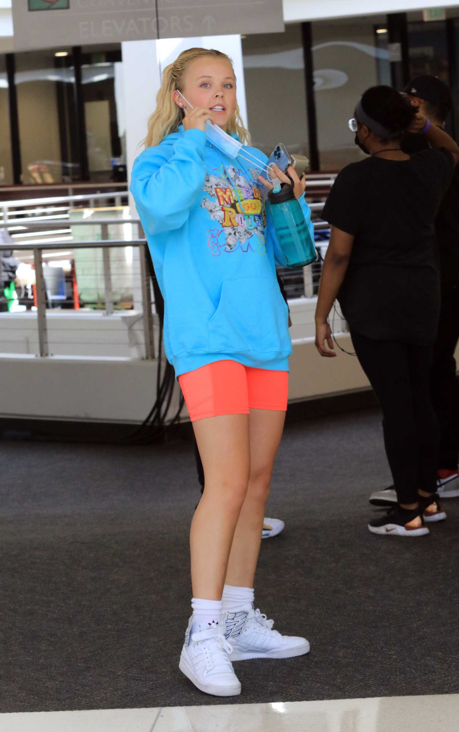 JoJo Siwa in a Baby Blue Hoodie Arrives at the Filming for America’s