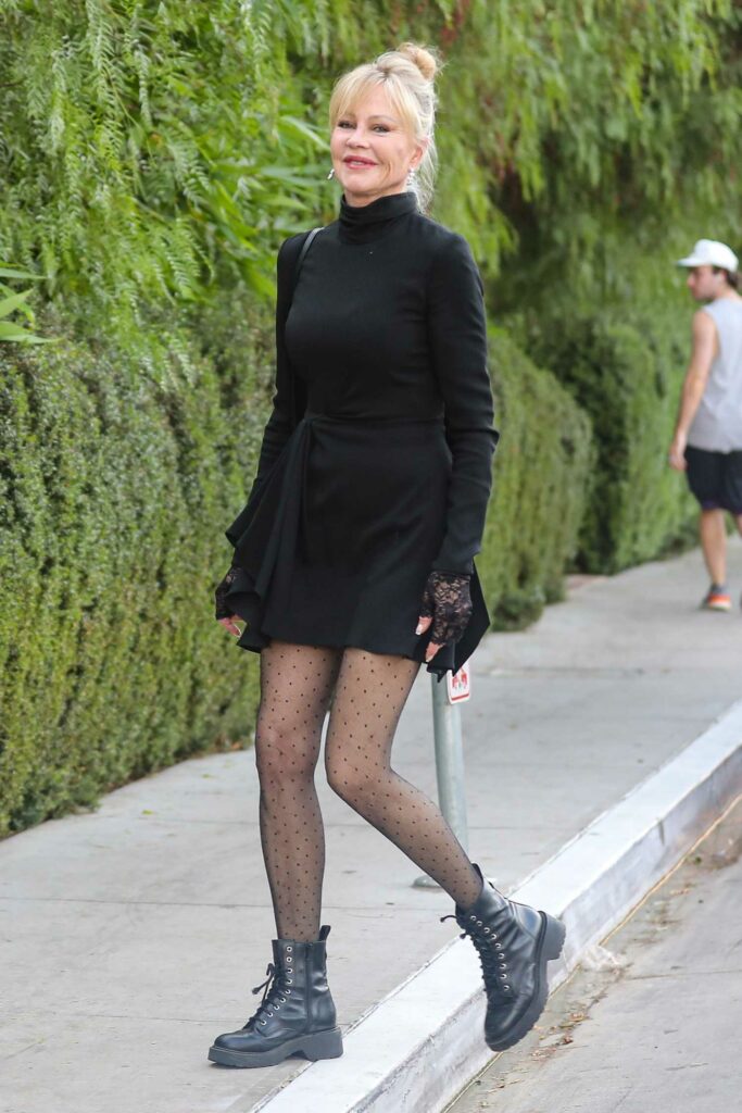 Melanie Griffith in a Short Black Dress