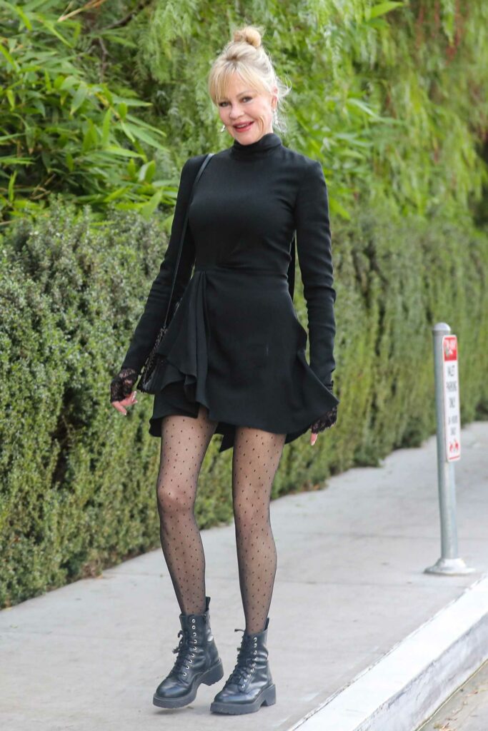 Melanie Griffith in a Short Black Dress
