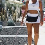 Nicole Murphy in a White Cap Walks Her Dog in West Hollywood