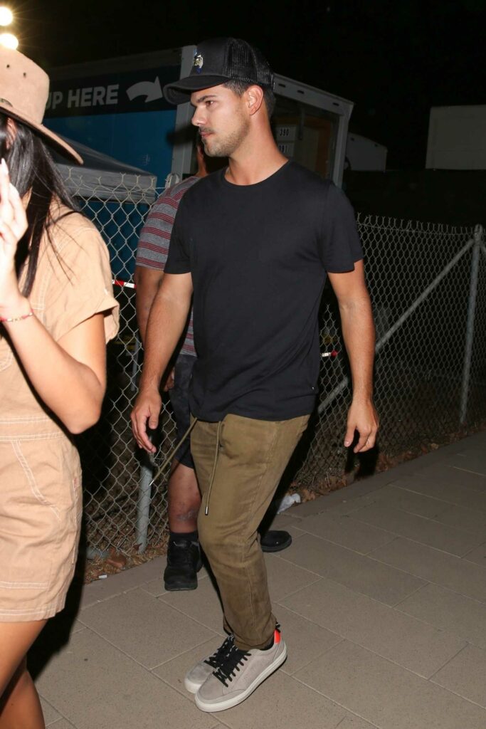 Taylor Lautner in a Black Tee