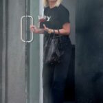 Ashley Benson in a Black Cropped Tee Exits a Massage Salon in Beverly Hills