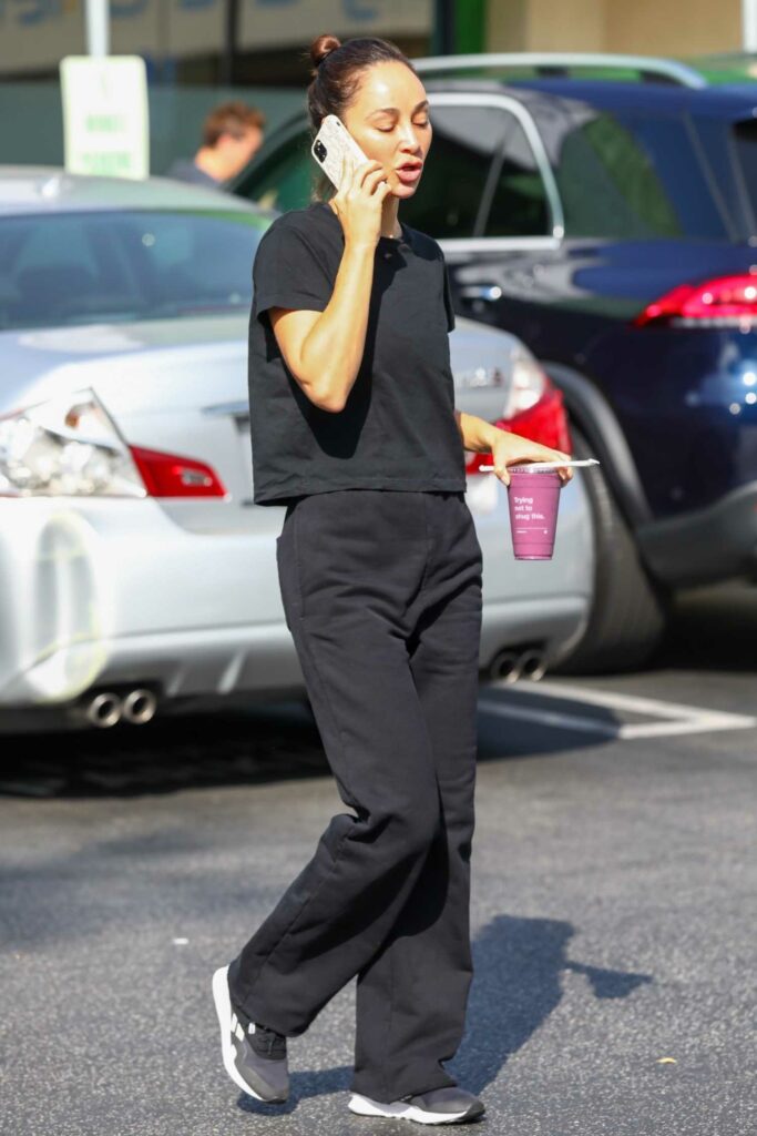 in a Black Tee Stops at EarthBar in Los Angeles 10/07/2022