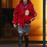 Dianne Buswell in a Red Jacket Leaves Her Hotel in London