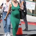 Heather Rae Young in a Green Form Fitting Dress Exits the Selling Sunset’s Oppenheim Group in West Hollywood