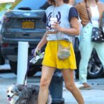 Helena Christensen in a Yellow Shorts Walks Her Dog in New York