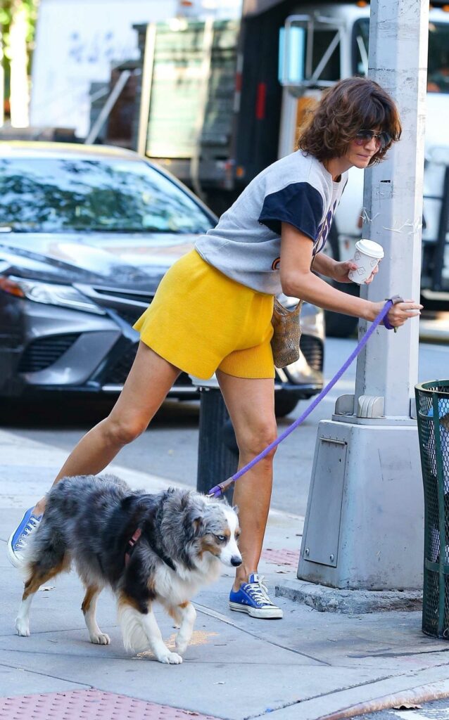 Helena Christensen in a Yellow Shorts