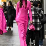 Lily Chee in a Pink Ensemble Arrives at the Valentino Fashion Show During 2022 Paris Fashion Week in Paris