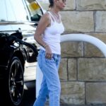 Lori Loughlin in a White Tank Top Waiting for Her Car to Fuel Up in Los Angeles