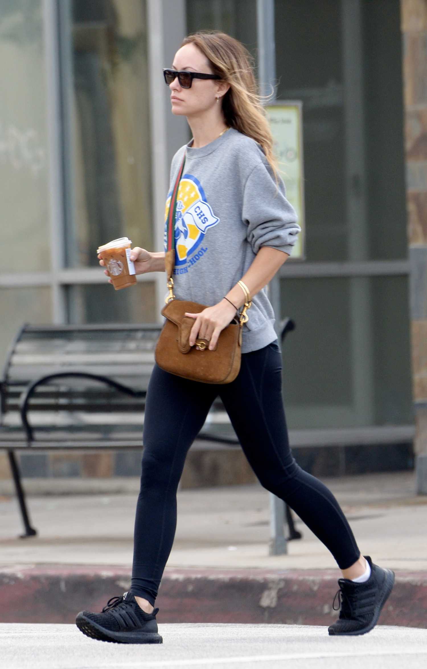 Olivia Wilde in a Grey Sweatsuit Grabbing Coffee at Starbucks in Los