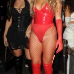 Antigoni Buxton in a Red Swimsuit Arrives at Maya Jama’s Halloween Party at Oslo Club in Hackney