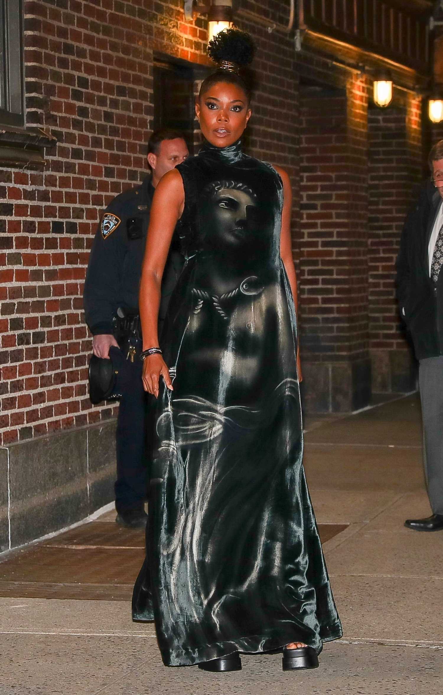 Gabrielle Union in a Black Unique Satin Dress Leaves the Stephen ...