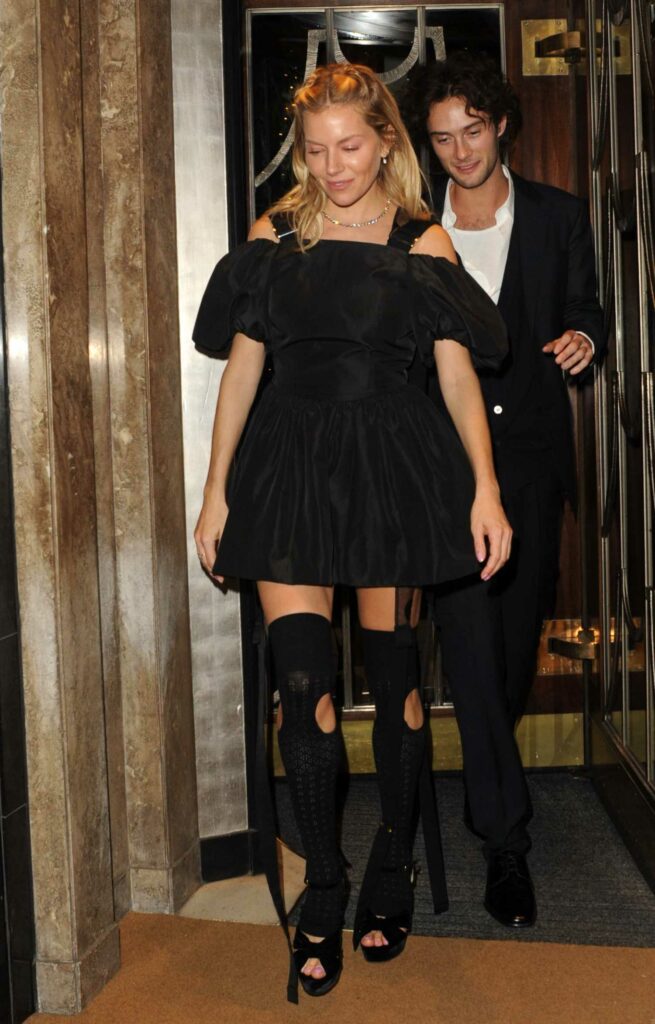 Sienna Miller in a Black Mini Dress