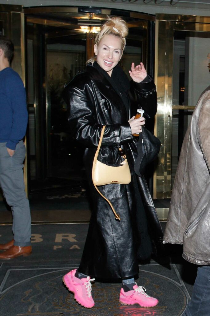 Christine Quinn in a Black Leather Coat