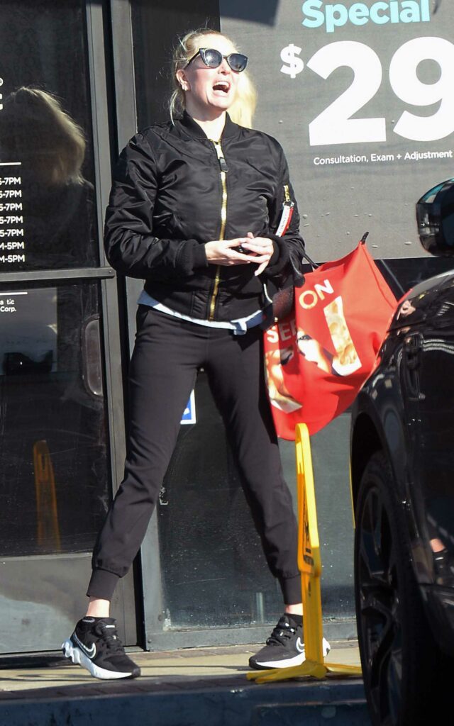 Erika Jayne in a Black Bomber Jacket