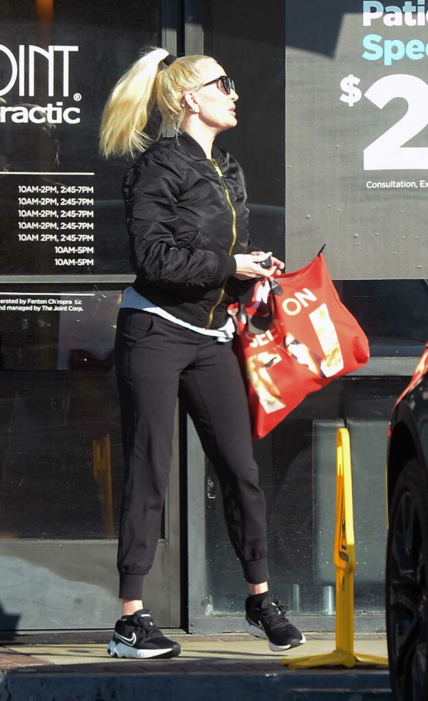 Erika Jayne in a Black Bomber Jacket