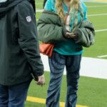 Fergie in an Olive Bomber Jacket Was Seen at the NFL Game Between the Miami Dolphins and the Los Angeles Chargers at SoFi Stadium in Inglewood