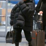 Janet Jackson in a Black Oversized Puffer Jacket Arrives at JFK Airport in New York