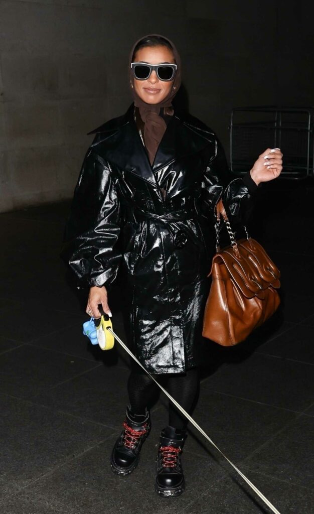 Melody Thornton in a Black Leather Trench Coat