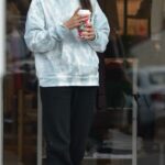 Mila Kunis in a Red Protective Mask Grabs Coffee at Starbucks in the Beverly Glen Shopping Center in Beverly Hills
