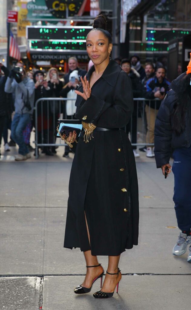 Naomi Ackie in a Black Coat