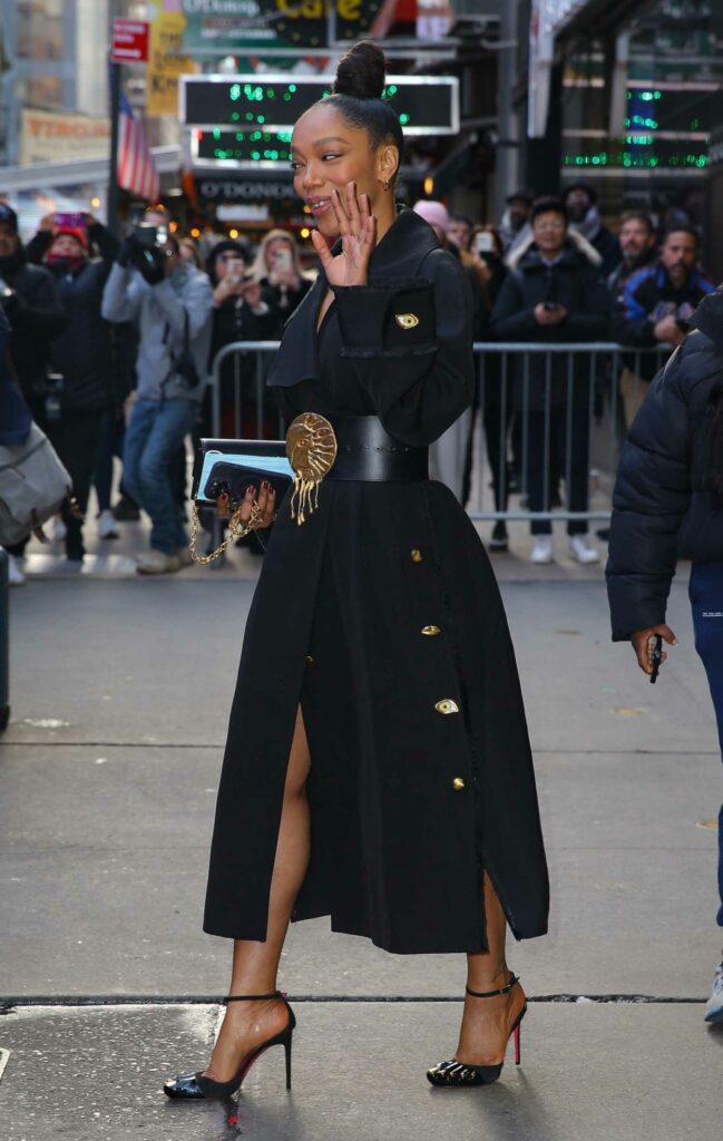 Naomi Ackie in a Black Coat