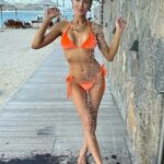 Christine Quinn in an Orange Bikini on the Beach in St Barts