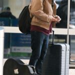 Robert Pattinson in a Black Cap Arrives at JFK Airport in NYC