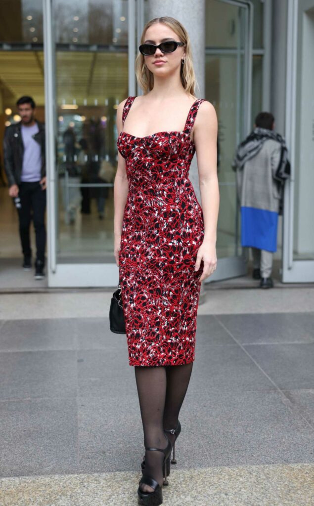 Emma Brooks in a Red Patterned Dress
