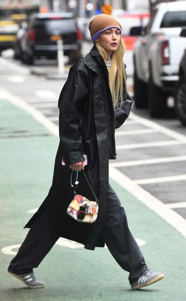 Gigi Hadid in a Black Leather Trench Coat