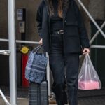 Karlie Kloss in a Black Jacket Carrying Her own Luggage in New York