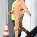 Mila Kunis in a Caramel Coloured Sweatsuit Returns from a Ski Trip in Los Angeles