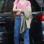 Milla Jovovich in a Pink Tee Heads to Breakfast at Mel’s Diner in Los Angeles