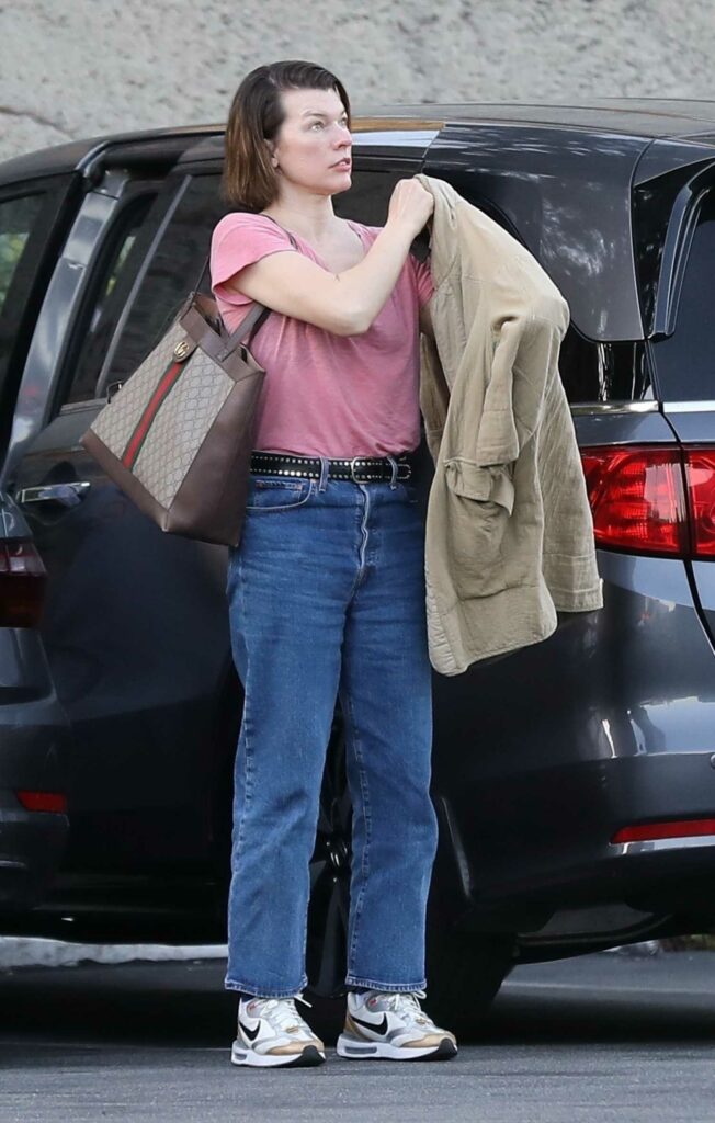 Milla Jovovich in a Pink Tee