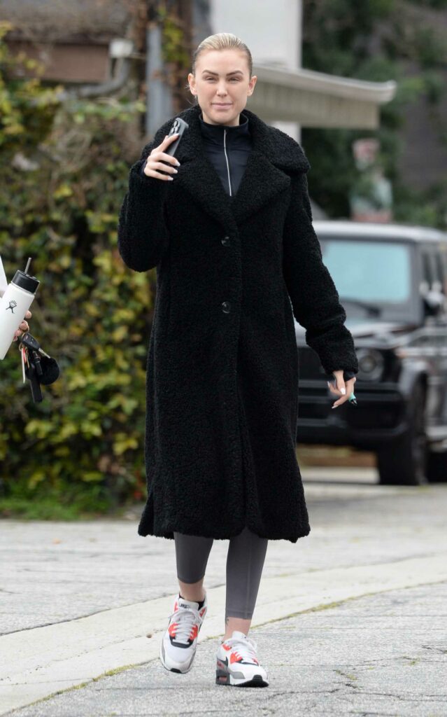 Lala Kent in a Black Faux Fur Coat