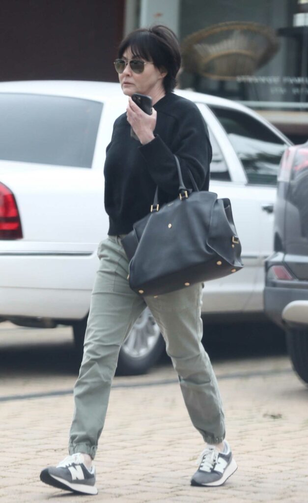 Shannen Doherty in a Black Sweatshirt